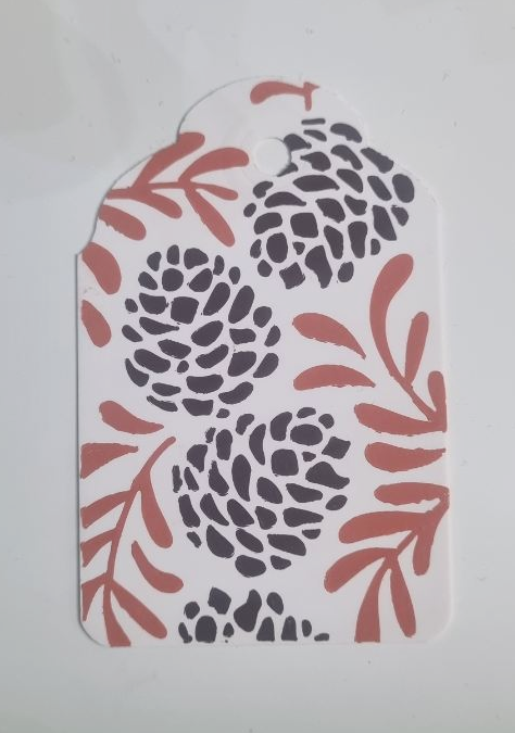 Embellissement étiquette motif pomme de pin